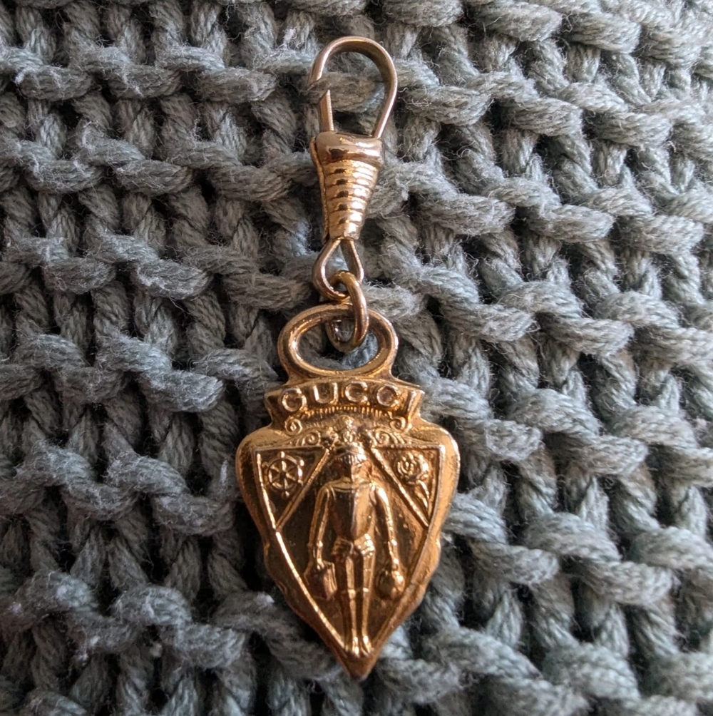 Gucci gold-tone crest charm pendant